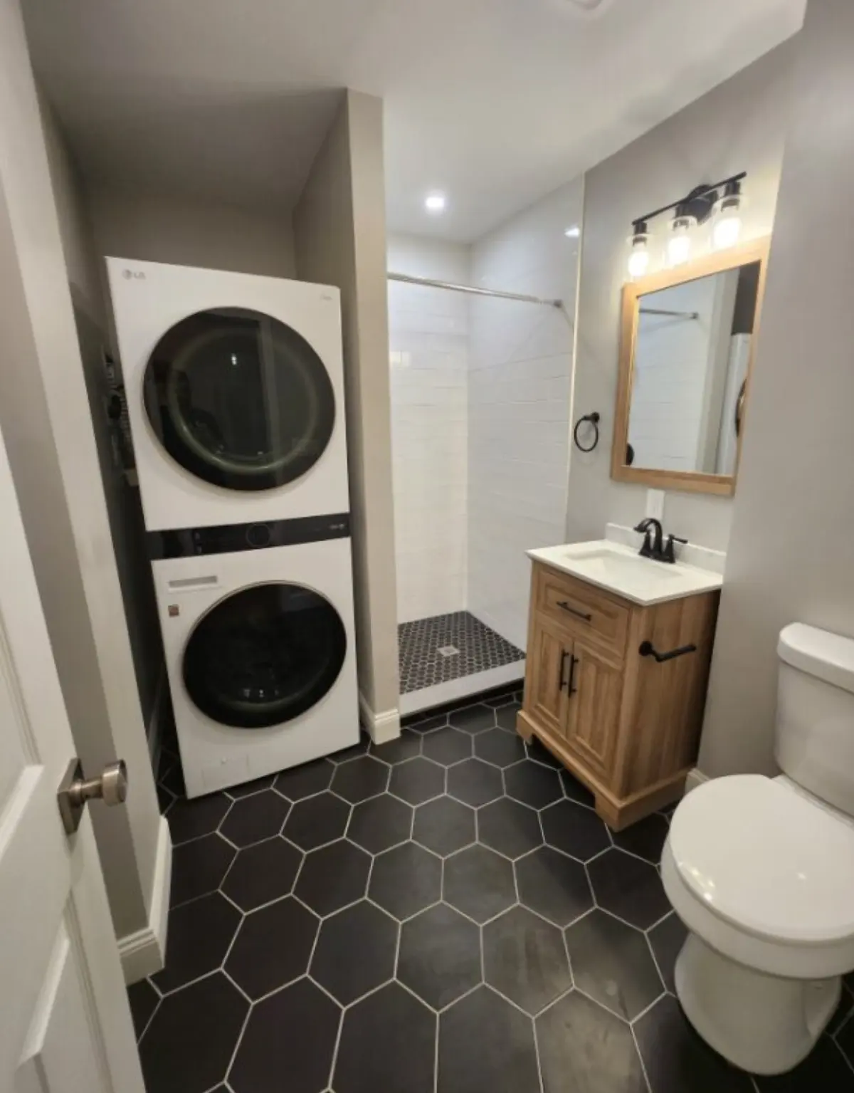 Modern bathroom after remodeling by Wolf Carpenters