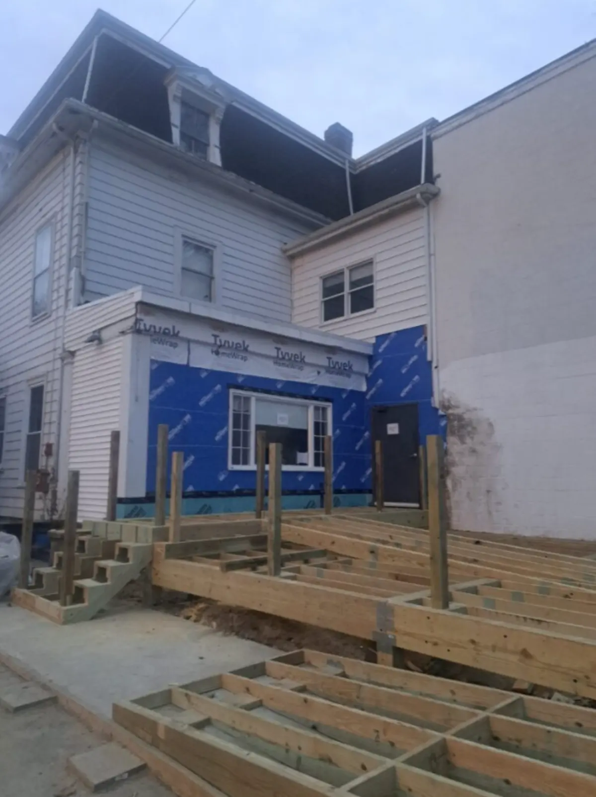 Backyard before deck installation by Wolf Carpenters