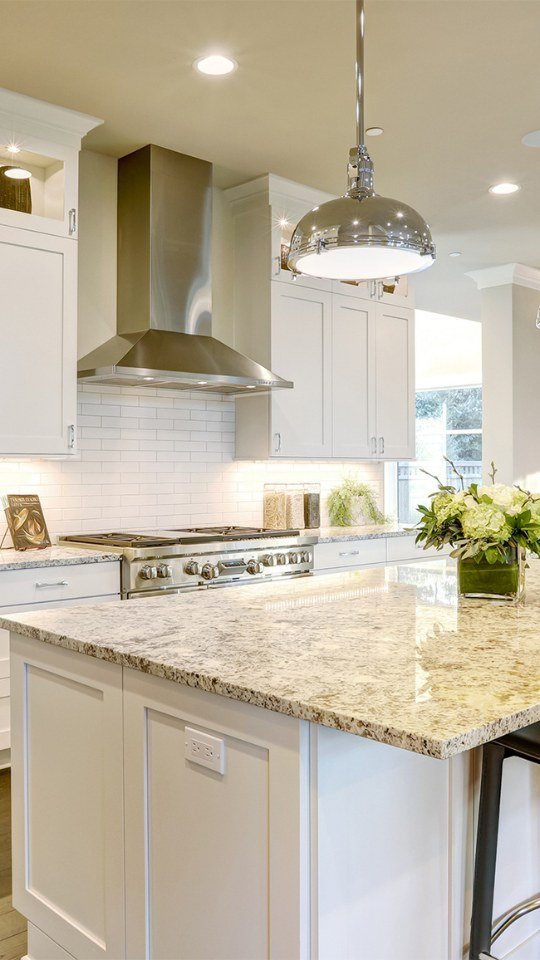 Kitchen remodel with white cabinets and granite countertops