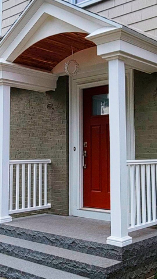 Custom front door and porch carpentry